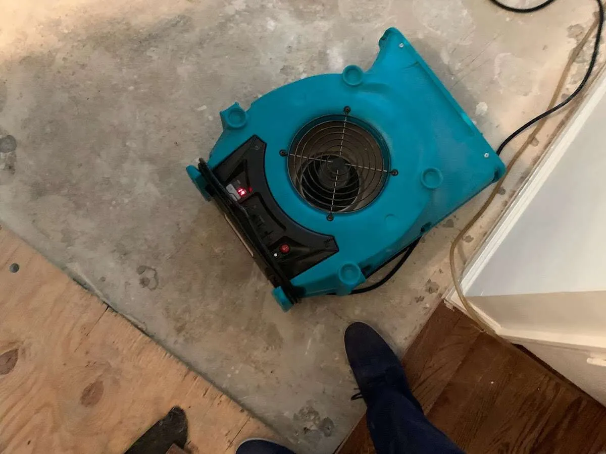 Air mover drying subfloor during Commercial Water Damage Restoration in Drexel Heights